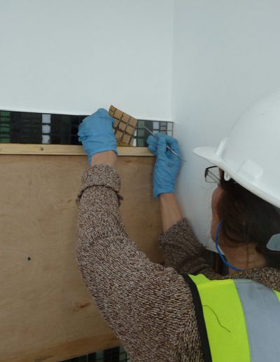 Joanna Kessel, Dunbar Primary School, installing the mosaic in the staff toilets